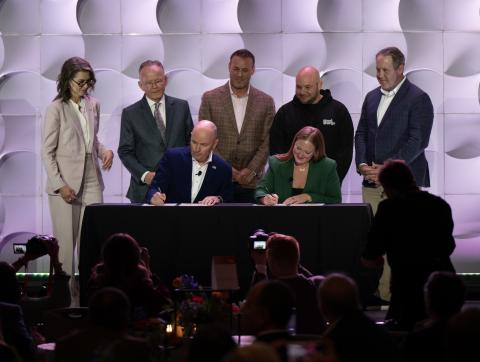 Permitting Council Executive Director Emily Domenech and Utah Governor Spensor Cox signing the Utah MOU