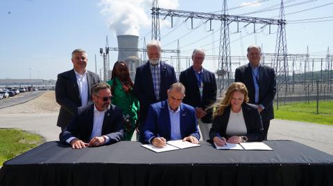 Executive Director Emily Domenech and Missouri Governor Mike Kehoe signing a memorandum of understanding (MOU) between the Permitting Council and the State of Missouri
