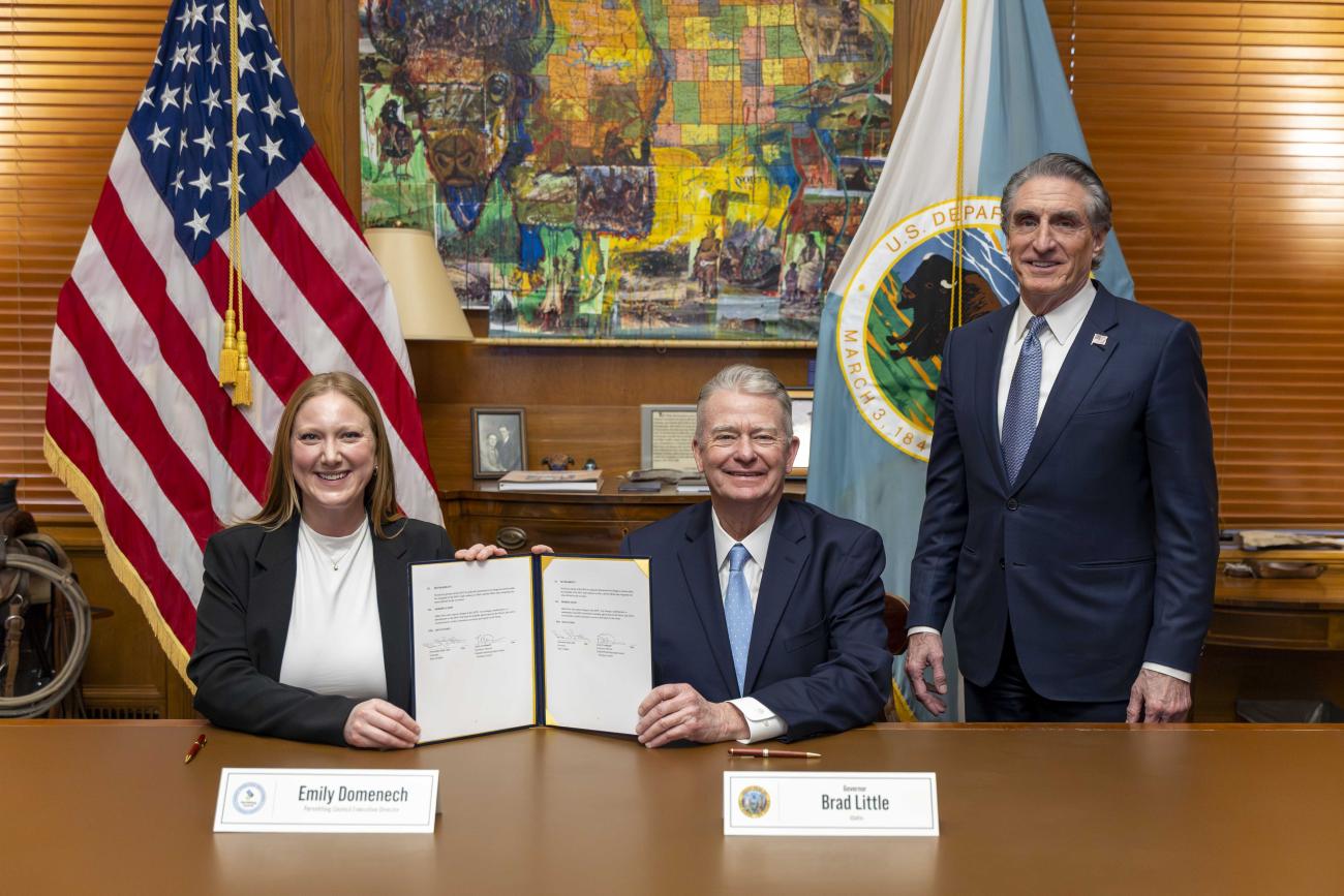 Executive Director Emily Domenech and Idaho's Governer Brad Little